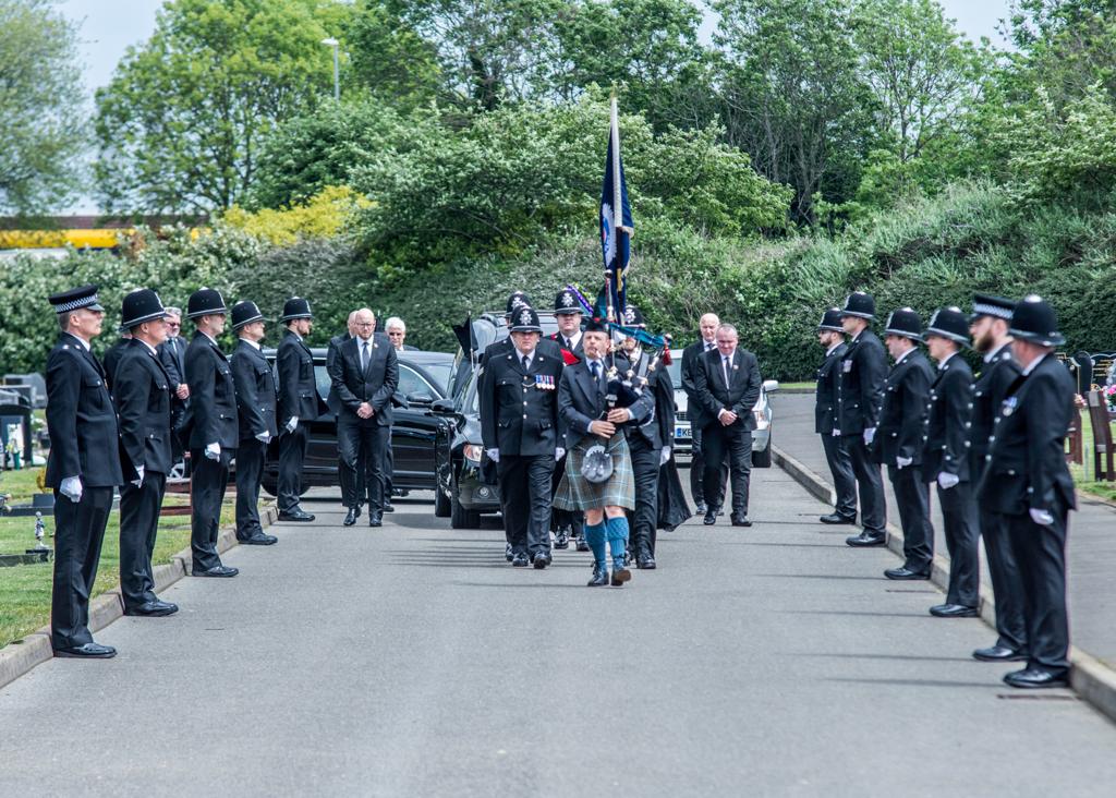 Scott leading a funeral procession